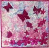 <h5>Beverley Howe - Butterfly Garden</h5><p>Pink suggests to me flowers and prettiness. In my stash I found a piece of marbled satin I had printed years ago. This dictated the use of satins for my other fabrics.                                                                                                                                                                                                                                                                                                                  </p>